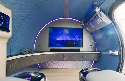 Blue quilted interior with a media wall