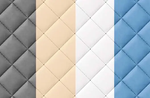 Quilted upholstery samples in grey, cream, white and blue